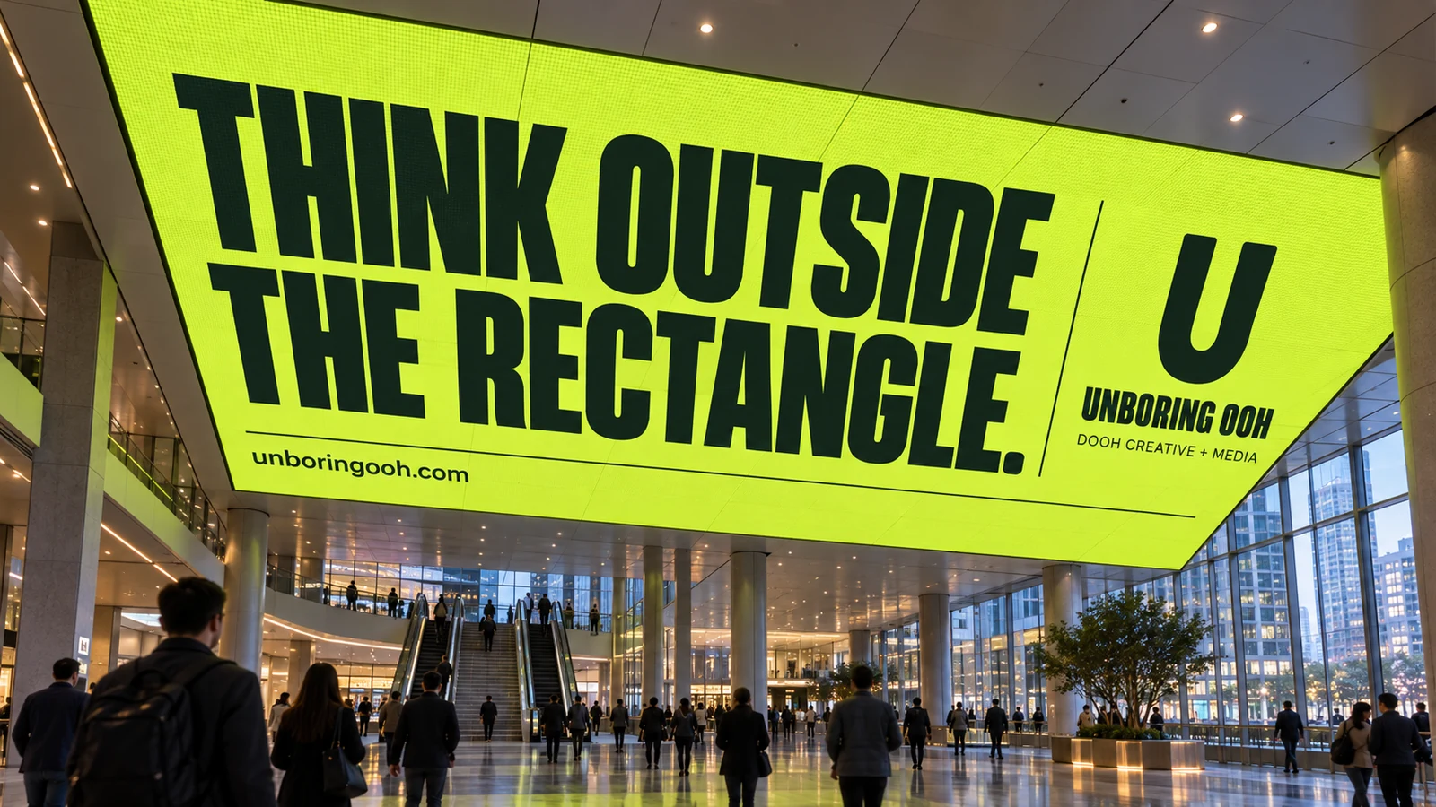 Unboring OOH ad on architectural & immersive screens. The ad reads: THINK OUTSIDE THE RECTANGLE.