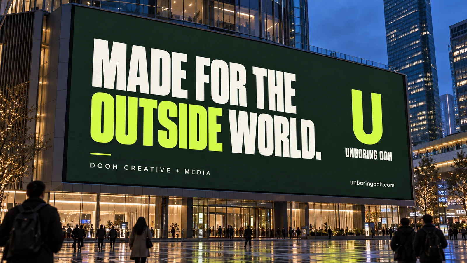 Unboring OOH ad on landmark digital screens. The ad reads: MADE FOR THE OUTSIDE WORLD.