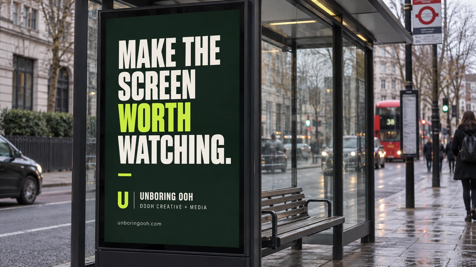 Unboring OOH ad on digital bus shelters. The ad reads: MAKE THE SCREEN WORTH WATCHING.