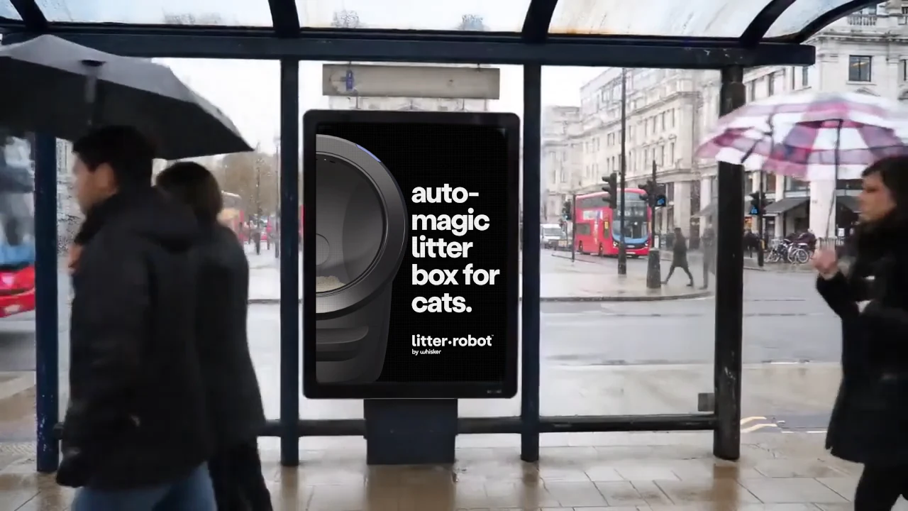 Whisker / Litter-Robot creative in a bus shelter placement visualization.